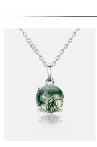 Detail of S925 silver necklace featuring a round green moss agate stone in 4-prong setting
