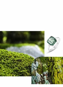 Detail of square moss agate ring with side diamonds on natural forest background
