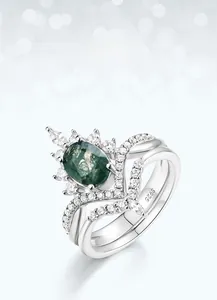Close-up of S925 silver crown ring set featuring oval green moss agate and zircons