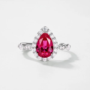 Elegant S925 silver ring with pear-cut ruby gemstone and halo diamond setting