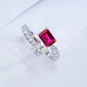 Luxurious S925 silver ring featuring red ruby and emerald cut clear gemstones in a dual setting