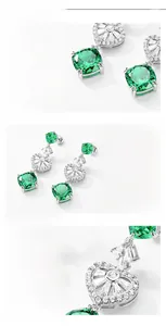 Detail of S925 silver drop earrings with square green garnet and heart-shaped hollow design