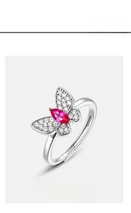 Macro shot of S925 silver butterfly ring with pink gemstone and open adjustable band