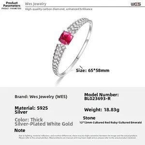 Macro view of S925 silver cuff bracelet with 12x12mm square red ruby and V-shaped diamonds
