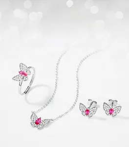 Detail of S925 silver butterfly jewelry set with pink lab rubies and pavé zircons