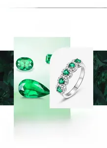 Detail of S925 sterling silver half eternity ring with emerald green stones and hallmark