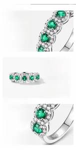 Detailed macro view of S925 sterling silver ring with emerald stones and hallmark