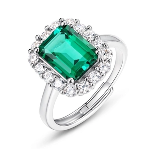 Vintage S925 silver ring featuring emerald-cut green gemstone with halo diamond setting