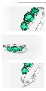 Detailed view of S925 silver ring featuring three prong-set lab-grown emerald stones