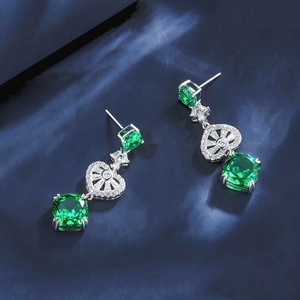 Elegant S925 silver drop earrings with green emerald-cut gemstones and heart detail
