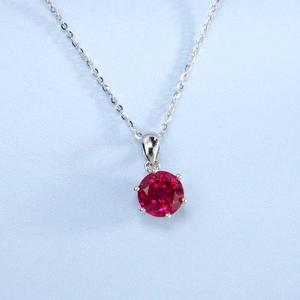 Macro view of lab-grown ruby pendant in S925 silver with classic six-prong setting
