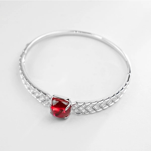 Luxurious S925 silver cuff bracelet featuring a sugarloaf-cut red ruby and V-shaped diamonds