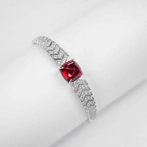 Luxurious S925 silver cuff bracelet featuring a red square gemstone and V-shaped pave zircon