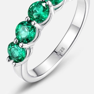 Vintage S925 silver ring featuring five claw-set lab-grown emerald stones in a row