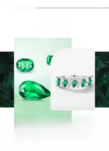 Detailed view of marquise-cut emerald ring with sparkling white cubic zirconia stones