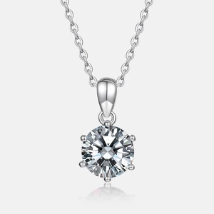 Detailed view of round-cut sparkling gemstone pendant with six-prong silver setting