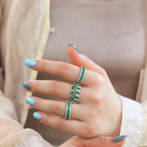 Exquisite S925 silver ring set with marquise emerald gemstones worn by a model