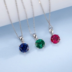 Three minimalist S925 silver necklaces with round-cut lab-grown red, green, and blue gems