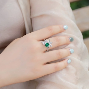 S925 silver ring featuring an oval emerald-cut gemstone with marquise diamond accents