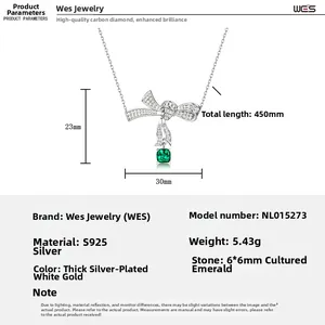 Detail of S925 silver bow necklace featuring a 6x6mm cushion cut emerald gemstone