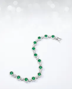 Macro shot of S925 silver emerald bracelet with sparkling halo zirconia accents