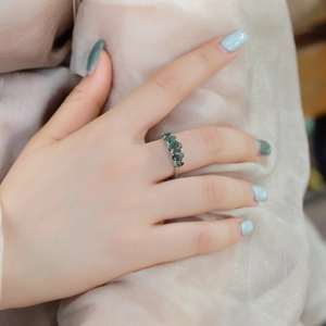 Minimalist S925 silver ring featuring four natural green moss agate stones on hand
