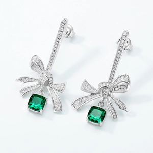 S925 sterling silver bow earrings with emerald green gemstones and sparkling accents