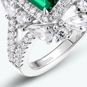 S925 sterling silver ring with emerald-cut green gemstone and teardrop accents