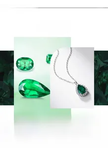 Detailed view of pear-cut emerald pendant with halo zircon setting on silver necklace