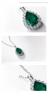 Macro detail of pear-cut emerald pendant with halo diamonds and S925 silver finish
