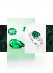 Macro shot of heart-shaped emerald stone with baguette and round white zircons on silver ring