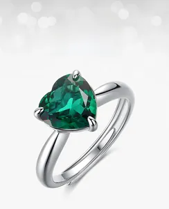 Detailed view of heart-cut green emerald ring with adjustable S925 silver open band