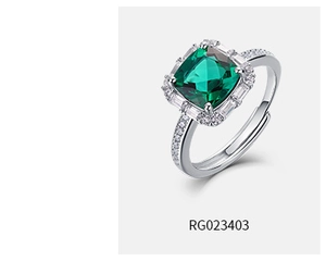 Macro shot of silver adjustable ring with square emerald gem and diamond halo