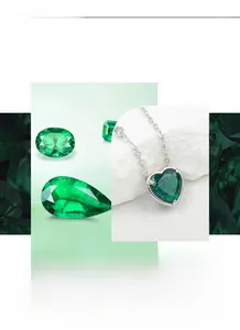 Detail of heart-shaped emerald pendant with zircon accents and sterling silver chain