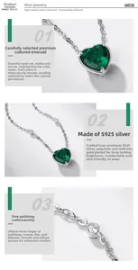Macro detail of S925 silver heart necklace with emerald gemstone and claw setting
