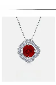 Macro shot of 925 silver necklace with square ruby pendant and small diamond accents