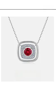 Macro detail of lab-grown ruby necklace with sparkling double halo diamond setting