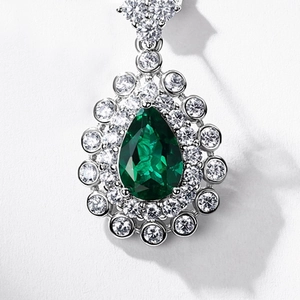 Luxurious pear-cut emerald pendant with double diamond halo in S925 sterling silver