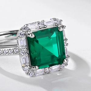 Elegant emerald cut green gemstone ring in S925 silver with a sparkling halo of diamonds
