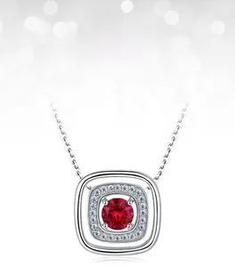 Close-up of a round lab-grown ruby necklace with halo diamonds in S925 silver