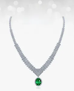 Close-up of green garnet necklace with pavé white zircons and luxury silver chain