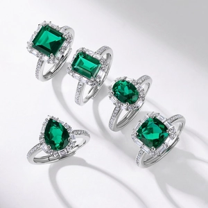 S925 silver emerald ring set with five different gemstone cuts in classic halo design