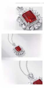 Detail of lab-grown ruby pendant in S925 silver with pear-cut side stones