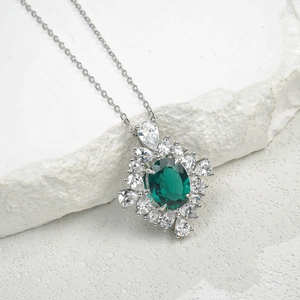 Luxurious S925 silver necklace with emerald-green oval gemstone and white halo cluster