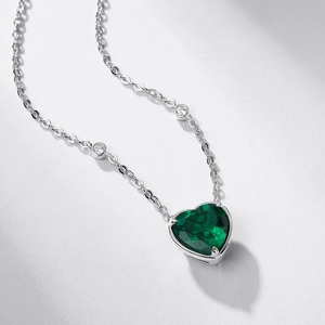 Elegant S925 silver heart emerald necklace with prong-set green stone and tiny diamonds