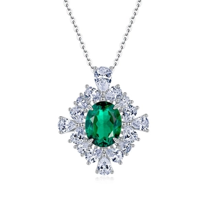 Elegant S925 silver necklace featuring a large oval emerald pendant with pear diamond accents
