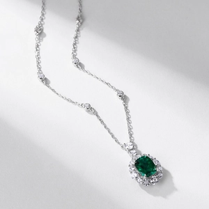 Vintage S925 silver necklace with emerald-cut green gemstone and sparkling diamonds