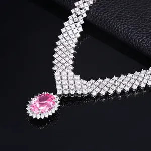 Close-up of luxury S925 silver necklace with oval pink gemstone and wide mesh diamond chain