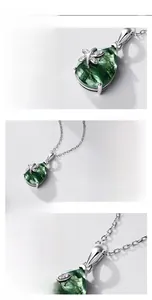 Detailed close-up of a dragonfly moss agate pendant with S925 sterling silver textures