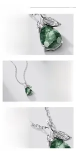 Macro shot of S925 silver teardrop moss agate pendant with micro-set diamonds